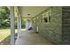 Covered patio with decorative lighting, offering an outdoor space for relaxation and entertainment at 6040 W Thompson Rd, Indianapolis, IN 46221