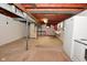 The basement features an exposed ceiling, white-painted walls, and a utility sink at 616 Gibbs Ct, Plainfield, IN 46168