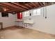 Basement offers a utility sink, a small table, and painted concrete walls at 616 Gibbs Ct, Plainfield, IN 46168