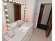 Bathroom featuring a white vanity, lighted mirror, and pink tile at 616 Gibbs Ct, Plainfield, IN 46168