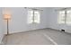 A light-filled bedroom with gray carpet and light blue walls at 616 Gibbs Ct, Plainfield, IN 46168