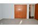 Bedroom with a closet and doorway, gray carpet and light blue walls at 616 Gibbs Ct, Plainfield, IN 46168