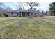 Charming single story home featuring a spacious yard and covered patio area at 616 Gibbs Ct, Plainfield, IN 46168