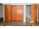 Hallway with wooden closet doors and a view of a bathroom at 616 Gibbs Ct, Plainfield, IN 46168