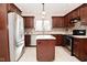 Modern kitchen featuring sleek stainless steel appliances and an island for extra counter space and convenience at 616 Gibbs Ct, Plainfield, IN 46168