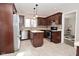 Modern kitchen with stainless steel appliances, an island, and stylish countertops for cooking enthusiasts at 616 Gibbs Ct, Plainfield, IN 46168