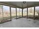 Enclosed porch has concrete flooring and offers views of the backyard at 616 Gibbs Ct, Plainfield, IN 46168