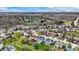 Overhead picture of a neighborhood near a tranquil pond, with homes boasting manicured lawns and mature trees at 6571 Hunters S Rdg, Zionsville, IN 46077