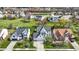 Neighborhood aerial view showcasing well-maintained homes, green lawns, and a serene pond at 6571 Hunters S Rdg, Zionsville, IN 46077