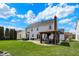 Lush backyard with a paved patio and inviting gazebo, creating a perfect outdoor retreat at 6571 Hunters S Rdg, Zionsville, IN 46077