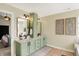 Stylish bathroom featuring double sinks, a standing cabinet, and modern fixtures, offering a spa-like experience at 6571 Hunters S Rdg, Zionsville, IN 46077