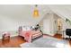 Charming bedroom featuring hardwood floors and natural lighting, creating a warm and inviting space at 6571 Hunters S Rdg, Zionsville, IN 46077