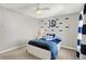 Bedroom with shark themed wall art, white trim, and a ceiling fan at 6571 Hunters S Rdg, Zionsville, IN 46077