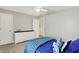 Bedroom with shark decor, a white dresser, and access to the hallway at 6571 Hunters S Rdg, Zionsville, IN 46077