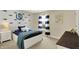 Bedroom with shark themed wall decorations, a bedside table, and a dresser at 6571 Hunters S Rdg, Zionsville, IN 46077