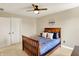 Bedroom with a ceiling fan and a bed frame with wood trim at 6571 Hunters S Rdg, Zionsville, IN 46077