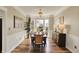 Formal dining room with hardwood floors, chandelier, and large windows, perfect for entertaining at 6571 Hunters S Rdg, Zionsville, IN 46077