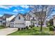 Charming two-story home with a three-car garage and a well-maintained lawn at 6571 Hunters S Rdg, Zionsville, IN 46077