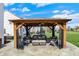 Relaxing outdoor gazebo featuring comfortable seating, perfect for enjoying the serene backyard at 6571 Hunters S Rdg, Zionsville, IN 46077
