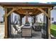 Charming gazebo with stylish outdoor furniture, creating an inviting space for relaxation and entertainment at 6571 Hunters S Rdg, Zionsville, IN 46077