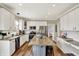 This spacious kitchen features white cabinets, stainless steel appliances, and a large center island at 6571 Hunters S Rdg, Zionsville, IN 46077