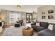 Comfortable living room with hardwood floors, neutral decor, and a view to the eat-in kitchen at 6571 Hunters S Rdg, Zionsville, IN 46077