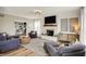 Spacious living room with hardwood flooring, fireplace, and comfortable seating at 6571 Hunters S Rdg, Zionsville, IN 46077