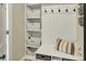 Functional mudroom with cubbies, hooks, and a bench, providing organized storage and a welcoming entry space at 6571 Hunters S Rdg, Zionsville, IN 46077