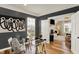 The office has a modern glass desk, hardwood floors, and large window for natural light at 6571 Hunters S Rdg, Zionsville, IN 46077