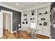 The office features hardwood floors, built-in shelving, and modern glass desk at 6571 Hunters S Rdg, Zionsville, IN 46077