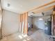 Unfinished basement with water heater, laundry tub and back door at 6616 W Thompson Rd, Indianapolis, IN 46241