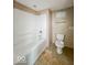 Bathroom features a white tub/shower combo that is awaiting updates at 6616 W Thompson Rd, Indianapolis, IN 46241