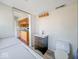 This bathroom area includes a sink, toilet, and is conveniently located near the kitchen through an open doorway at 6616 W Thompson Rd, Indianapolis, IN 46241
