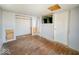 Cozy bedroom features closet space, and a spot for a wall-mounted television, offering both comfort and convenience at 6616 W Thompson Rd, Indianapolis, IN 46241