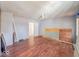 Living room featuring hardwood floors and ceiling fan needs remodeling at 6616 W Thompson Rd, Indianapolis, IN 46241