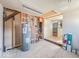 Bright utility room shows water heater with access to the living space at 6616 W Thompson Rd, Indianapolis, IN 46241