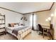 Inviting bedroom boasts neutral walls, carpet floors, and well lit desk area at 7152 Sandalwood Dr, Avon, IN 46123