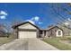Lovely home featuring an attached two-car garage and a long concrete driveway at 7152 Sandalwood Dr, Avon, IN 46123