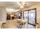 Eat-in kitchen featuring wood cabinets, modern appliances, and an adjacent breakfast nook at 7152 Sandalwood Dr, Avon, IN 46123