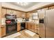 Well-equipped kitchen featuring stainless steel appliances and wood cabinetry at 7152 Sandalwood Dr, Avon, IN 46123