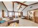 Inviting living room with vaulted ceiling, wood beams and neutral colors at 7152 Sandalwood Dr, Avon, IN 46123