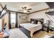 Spacious main bedroom boasts neutral walls, ceiling fan, plush bed, and natural light at 7152 Sandalwood Dr, Avon, IN 46123