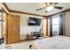Bright and airy main bedroom features a large TV, modern furniture, and natural light at 7152 Sandalwood Dr, Avon, IN 46123