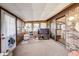 Cozy sunroom with carpet floors, brick accent wall and sliding doors for natural light at 7152 Sandalwood Dr, Avon, IN 46123