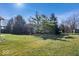 Spacious backyard featuring a well-maintained lawn and mature trees at 7236 Wyatt Ln, Indianapolis, IN 46217