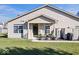 Charming backyard featuring a well-maintained lawn and a cozy patio area with furniture at 7236 Wyatt Ln, Indianapolis, IN 46217