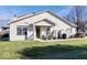 Charming backyard featuring a well-maintained lawn and a cozy patio area with furniture at 7236 Wyatt Ln, Indianapolis, IN 46217
