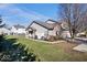 Beautiful home with well-manicured lawn and complemented by mature landscaping at 7236 Wyatt Ln, Indianapolis, IN 46217