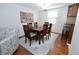 Dining room with hardwood floors and seating for six provides space to entertain Gathering and friends at 7318 Chimney Rock Ct, Indianapolis, IN 46217