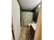 Bathroom with tile floors, tropical shower curtain, dark wood vanity, and white sink and toilet at 7902 Benjamin Dr, Lawrence, IN 46226